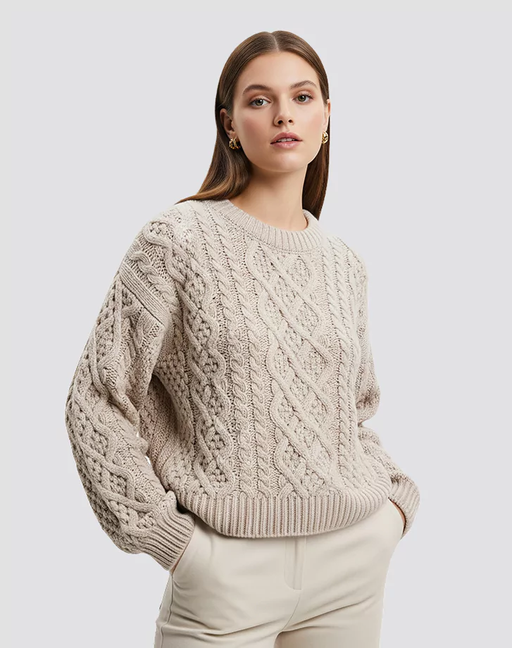 A model wearing soft, lightweight wool cable knit sweater